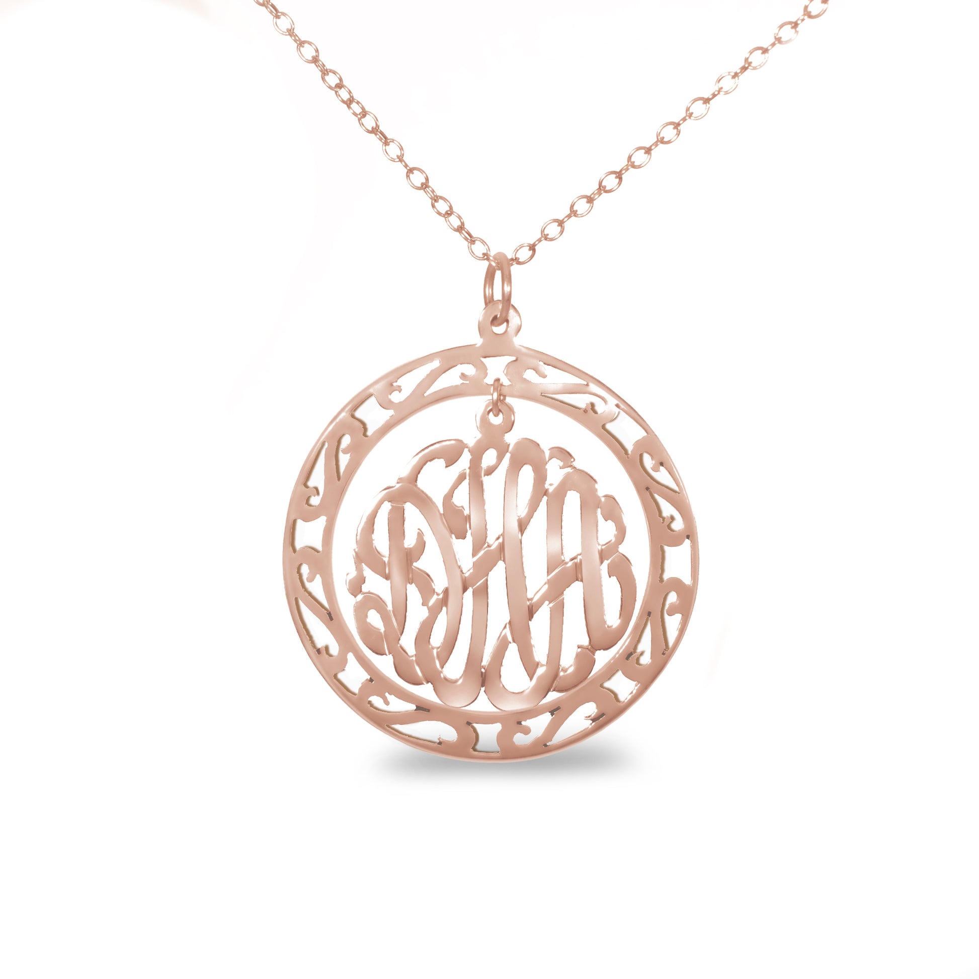 rose gold-plated silver round monogram necklace hanging inside a hollow teardrop pendant