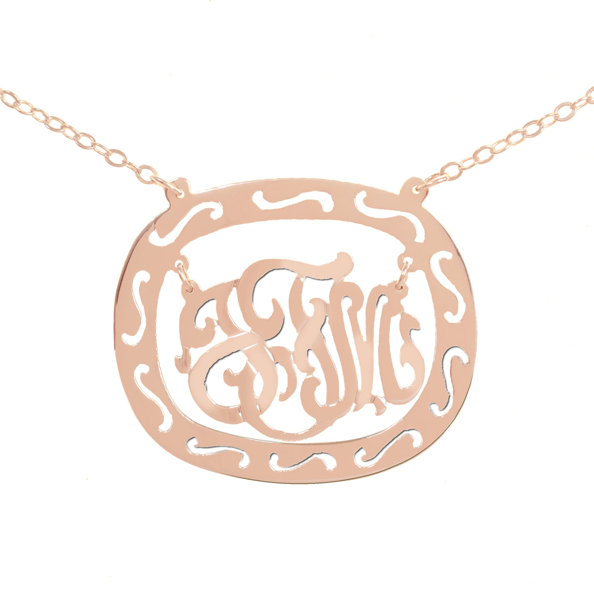 rose gold-plated silver oval monogram necklace inside thick patterned circular frame
